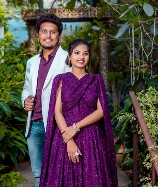 A handsome groom-to-be in a stylish purple shirt and white blazer for his pre-wedding shoot.