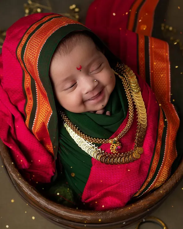 This is the heart of my work. A tiny Maharashtrian beauty, just days old, blessing us with a divine smile during our Ganesh Chaturthi setup. These are the soulful, timeless portraits I live to create.
