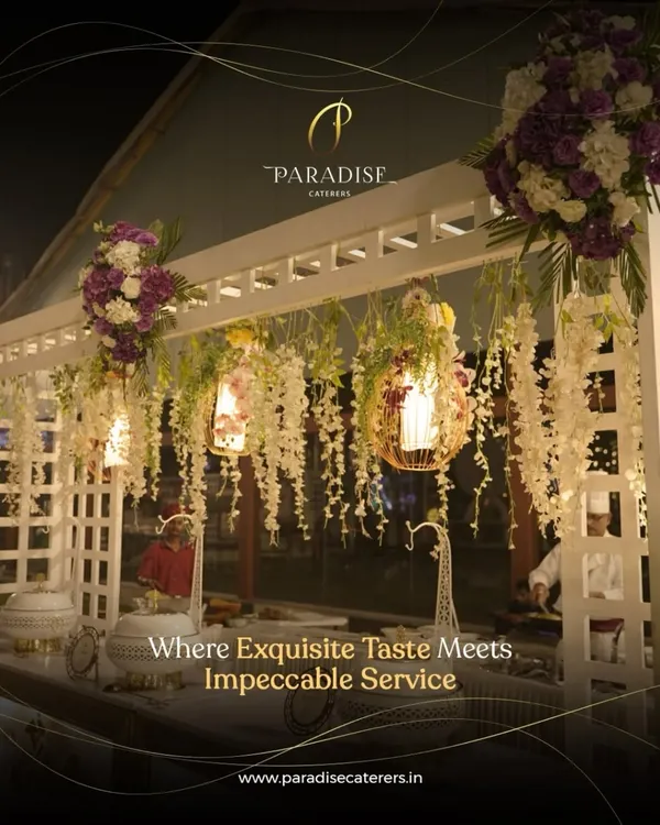 Our catering service goes beyond food; we create an experience. This elegant buffet station, adorned with cascading flowers and beautiful lighting, reflects our philosophy of combining great taste with impeccable presentation.