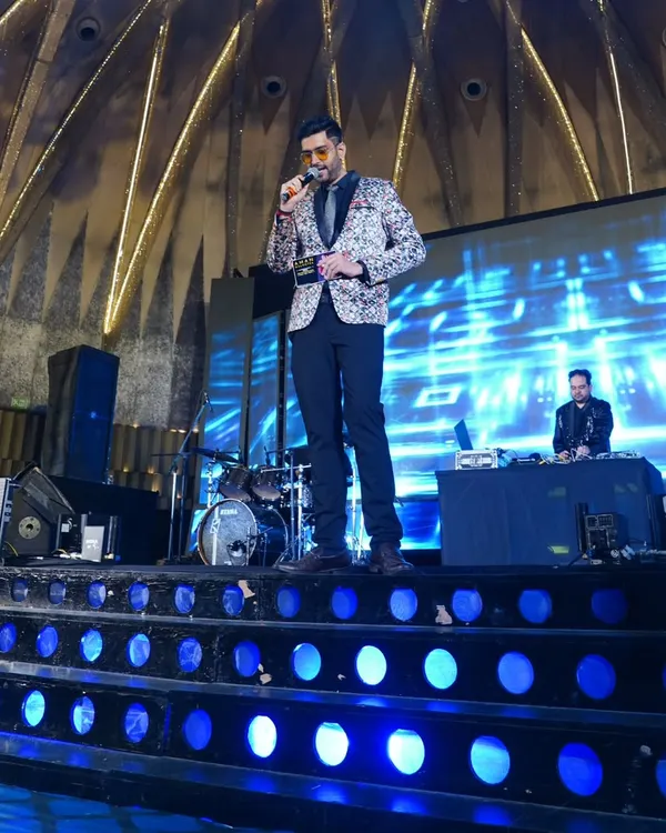 Owning the stage at a grand wedding sangeet. My job is to keep the energy high and the celebrations flowing, ensuring it's a night the family will cherish forever.