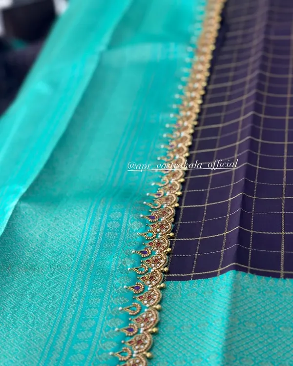 An elegant saree border featuring delicate kemp-style embroidery with pearl details.