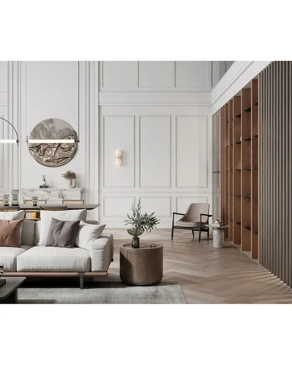 This living room combines classic elegance with modern comfort. We used decorative wall molding, a statement art piece, and a mix of textures to create a refined and inviting space.