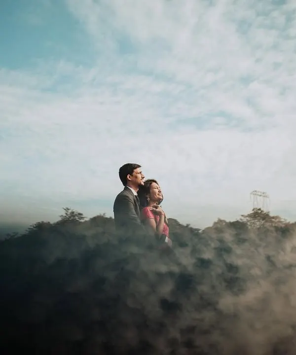 A truly magical pre-wedding moment for this couple, wrapped in mist on a Lonavla hilltop. We used a smoke effect to create this dreamy, 'head in the clouds' feeling, making their love story look like a scene from a movie.
