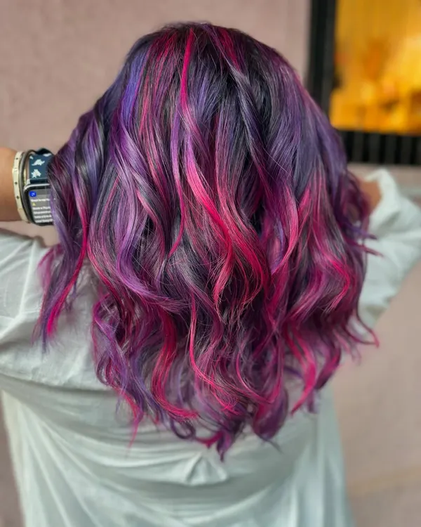 This look is GIVING! A fun mix of purple and pink waves for a vibrant, playful style. This is a bleach color, perfect for when you want your hair to do all the talking. (No filter)