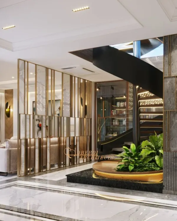 This central atrium is an experience in itself, with a dramatic interplay of textures, a mirrored partition, and a spiral staircase wrapping around a green planter.