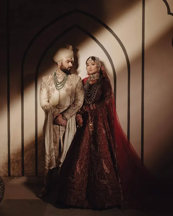 The couple, Bismil and Shifa, in a moment of quiet connection. The decor, with its soft lighting and clean architectural lines, provides a backdrop that is both regal and deeply intimate, reflecting the soulful nature of their union.