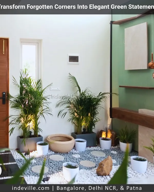 I transformed this forgotten indoor corner into an elegant green statement. Using a bed of white and grey pebbles, stepping stones, and uplighting for the palms, I created a sophisticated, zen-like garden that redefines the space.