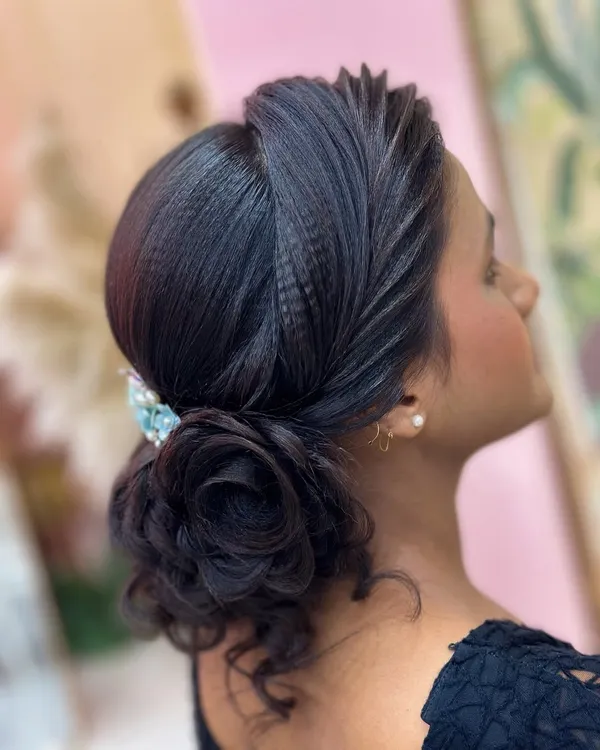A beautiful and intricate rose bun hairstyle, created as a demonstration for my students. This elegant updo is perfect for a reception or any formal event.