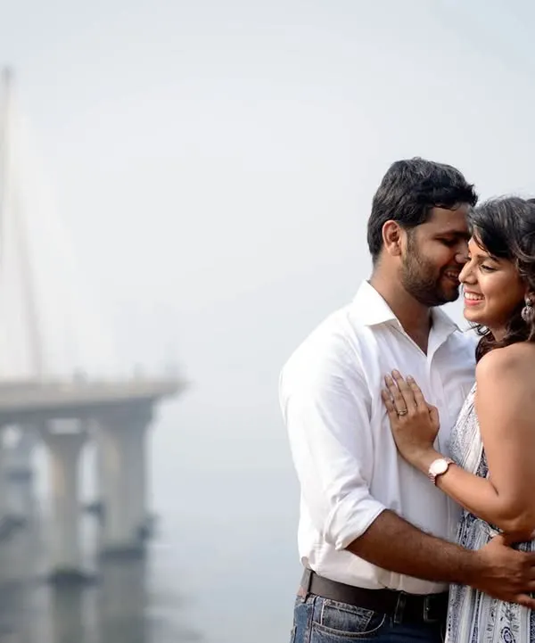 A candid couple portrait with the iconic Bandra Worli Sea Link in the background. I love using familiar cityscapes to create a personal story for couples in Mumbai.