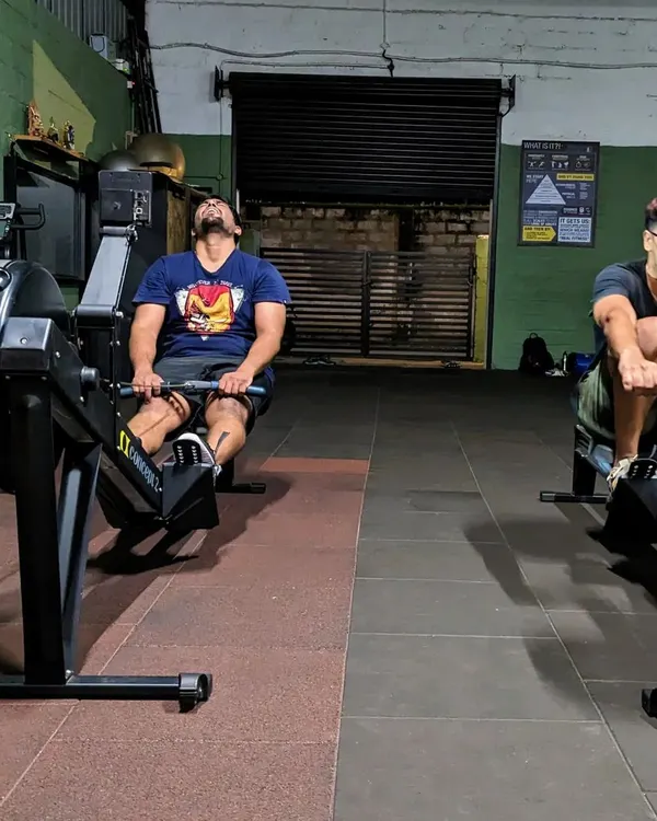 Two members deep in the pain cave on the rowing machines. Self-respect leads to self-discipline, and workouts like this build both. It's about pushing your limits and finding real power within.