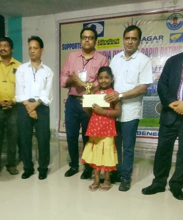 My student Shivani with her first-place trophy and cash prize at the All India Open Fide Rapid Rating Chess Tournament 2021. Our tournament preparation focuses on achieving success at the highest levels.