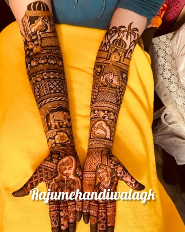 Here, the bride and groom portraits are the main focus on the palms. The design extends up the arms with traditional elements like elephants and palace architecture, creating a complete story.