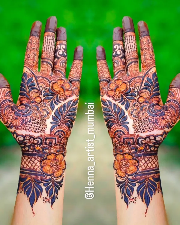 This is my passion in one picture. I love creating these full, symmetrical designs that are perfect for making a statement at any celebration. Notice the fine details and the balance between the bold florals and delicate leaf patterns.