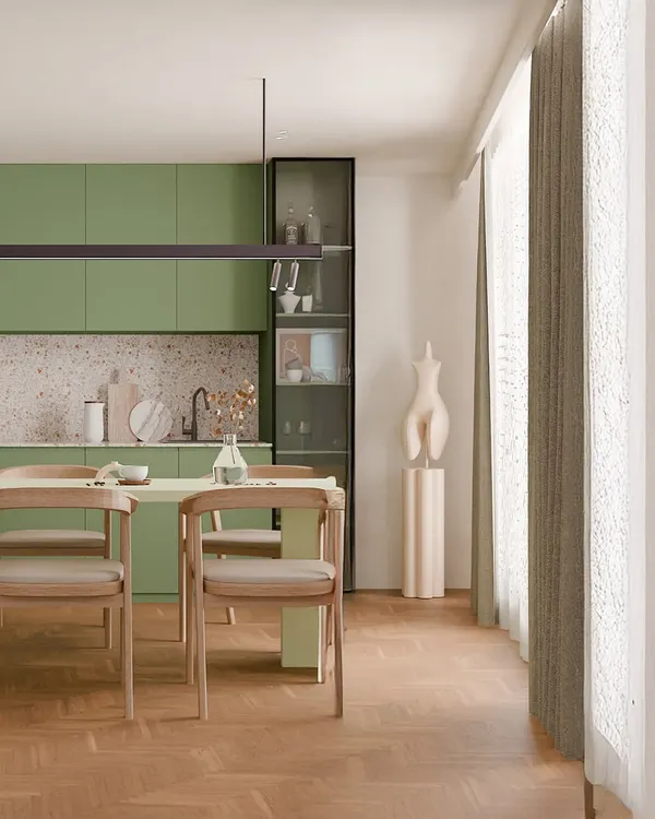 This olive-toned kitchen blends modern utility with earthy calm. The terrazzo backsplash and sleek, handleless cabinets create a clean look, while the adjoining dining area with natural wood textures makes it a cozy spot for everyday meals.