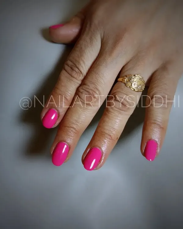 A classic and vibrant hot pink gel polish manicure. A perfect pop of color for any occasion.