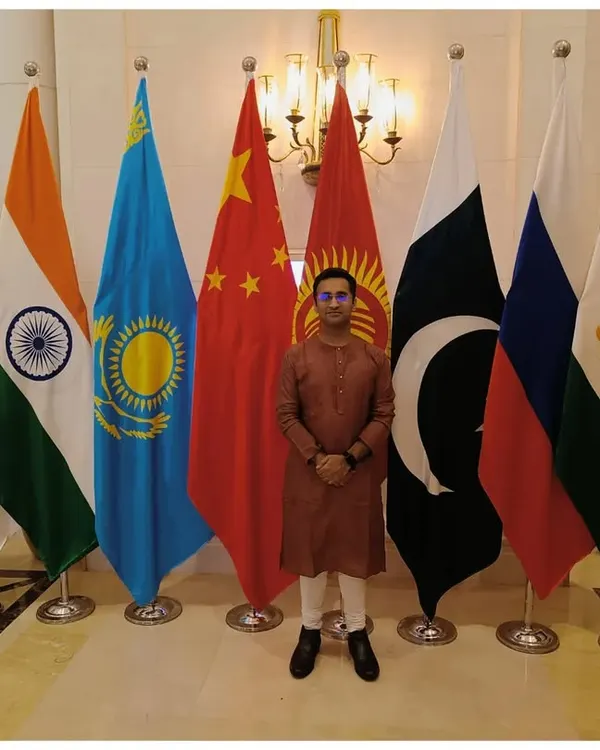 Standing with the flags of the member nations at a G20 event in New Delhi. I provide musical services for high-profile government and diplomatic functions.