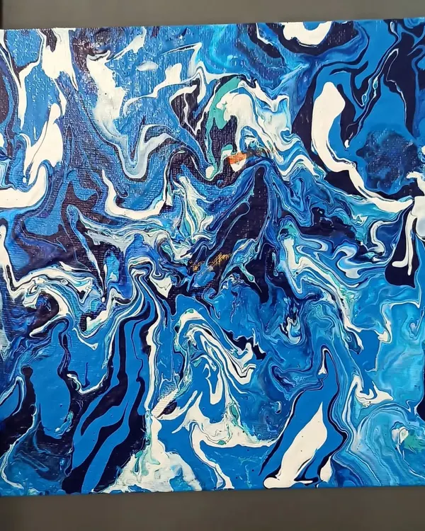 This piece was created using the fluid art technique, where I pour and manipulate liquid acrylics on canvas. The result is a unique, organic pattern reminiscent of ocean waves.