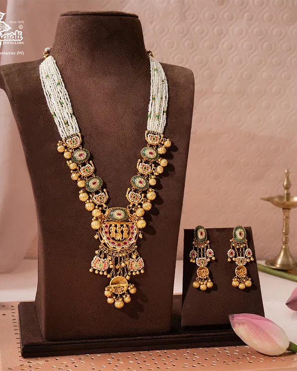 The Rajnitya Haar, a woven anthem of 22ct gold, is the heart of our heritage collection. Its intricate motifs and ceremonial grandeur are designed to be a centerpiece of bridal trousseaus, destined to become a cherished family heirloom.