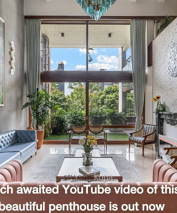 This sun-drenched penthouse living room is one of my favorite projects. We designed it to feel open, grand, and full of life, using a double-height ceiling and large windows to bring the outdoors in. The mix of pastel sofas, a custom art piece, and a stunning turquoise chandelier creates a space that is both luxurious and deeply personal.