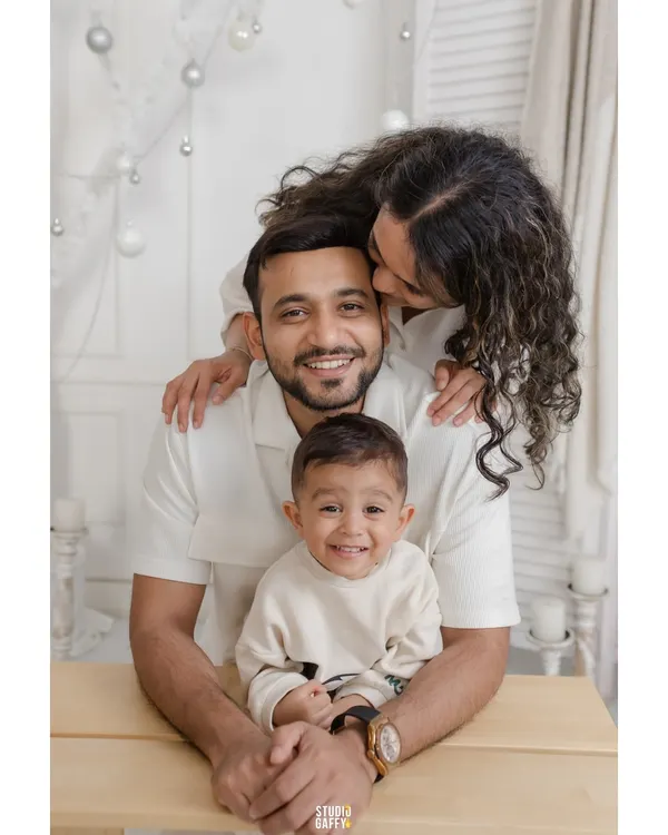 A beautiful family portrait in our all-white "Winter Wonderland" Christmas set. The coordinated white outfits create a serene and elegant holiday card photo.
