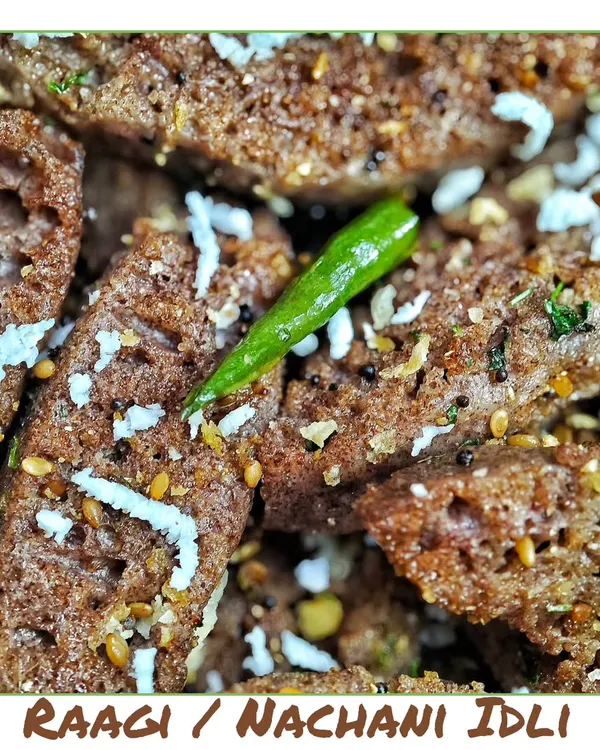 My fluffy and healthy Ragi Idli, also known as Nachani Idli. Made from finger millet, this is a nutritious and tasty snack, garnished with grated coconut and green chilli.