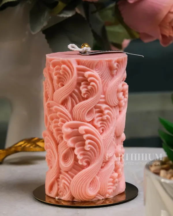 This intricately carved pink pillar candle is one of my most detailed designs. The wave-like pattern creates a beautiful play of light and shadow, making it a true statement piece.