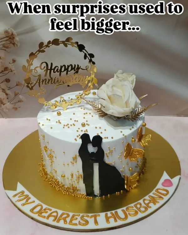 A beautiful anniversary cake for "My Dearest Husband." The design features a silhouette of a couple, golden butterflies, and a "Happy Anniversary" topper.