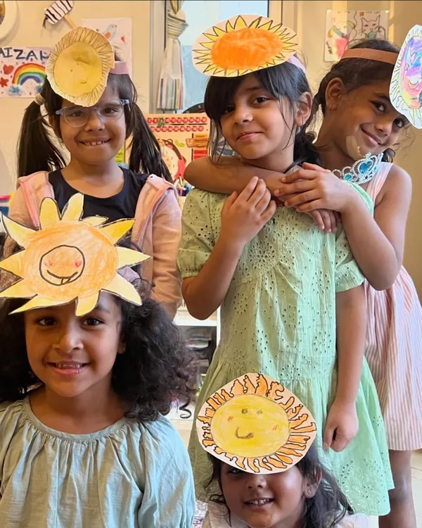 A group of smiling suns. The kids are so proud to wear the sun headbands they created during our "All About the Sun" session.