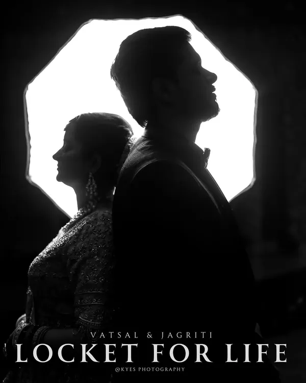 A powerful black and white silhouette of a couple, with the words "Locket for Life". The dramatic backlighting and strong composition create a timeless and artistic statement.