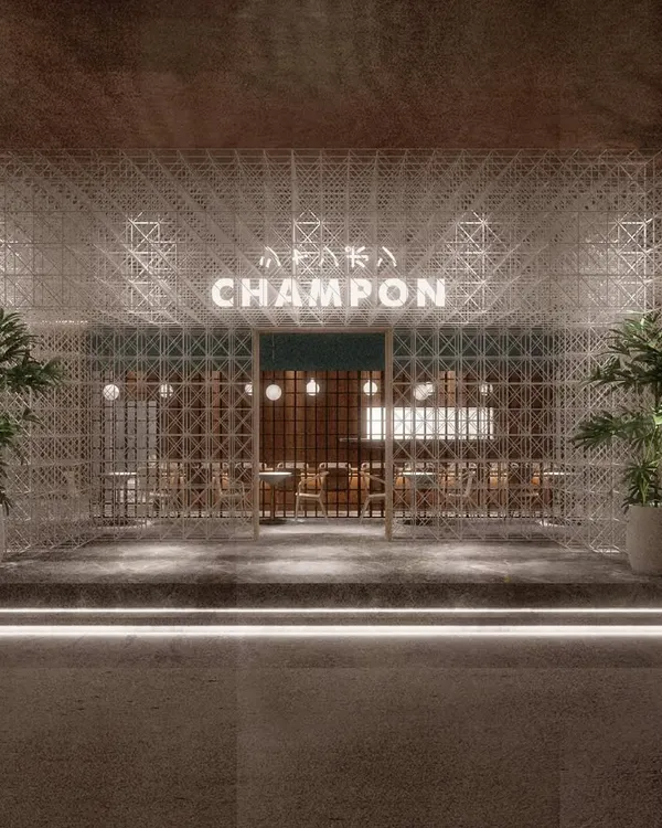 The geometric facade of CHAMPON restaurant in Mumbai. We designed this intricate exterior to create a powerful first impression, hinting at the blend of modern minimalism and traditional Japanese elegance that awaits inside.