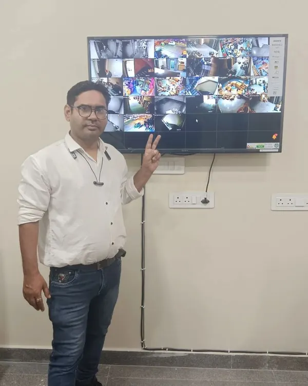 This is the final setup for a multi-camera IP installation. I ensure all camera feeds are clearly visible on a central monitor and that the wiring is clean and properly managed for long-term reliability.