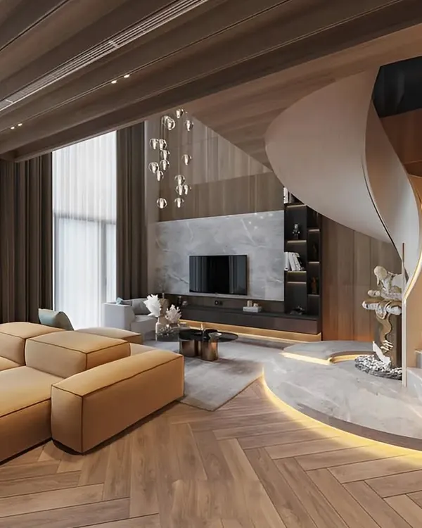 We design breathtaking living spaces that combine grandeur with comfort. This duplex living room features a stunning spiral staircase, herringbone wood flooring, and integrated lighting to create a truly aspirational home environment.