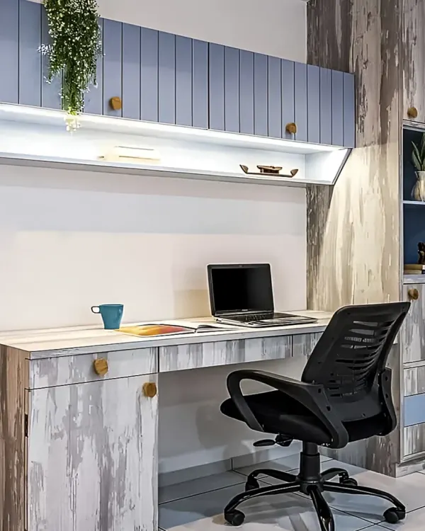 A stylish home office with a rustic, distressed wood finish. The design includes ample overhead storage cabinets with integrated lighting and a spacious desk for a comfortable work environment.