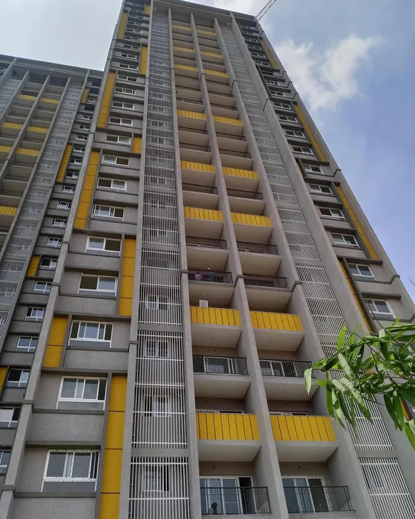 A duplicate image of the Salarpuria Sattva Opus residential apartment building.