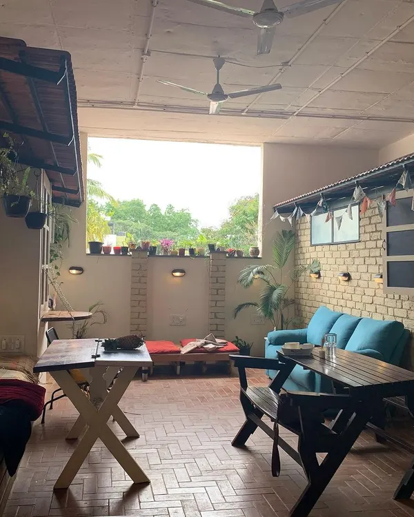 Welcome to our space. This is our cafe and lounge area, a place to relax, connect, and create before or after class. We made this space with love.