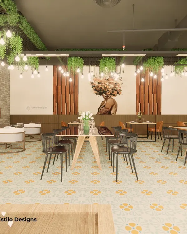 This cafe was designed with a Scandinavian-inspired color palette, using tan and earthy tones. The space features varied seating arrangements, abundant greenery, and unique artwork to create a warm and eclectic atmosphere for patrons.
