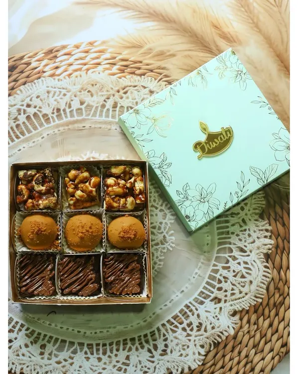 A top-down view of my "Flavours of Diwali" box, featuring a mix of fusion sweets and classic brownies. The elegant packaging makes it a perfect gift for the festive season.