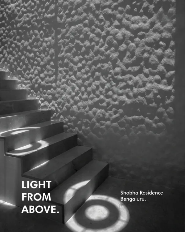 Design isn't always about new materials. In this stairwell at the Shobha Residence, we reimagined a simple aluminum pot as a custom skylight, transforming the space by casting unique, circular patterns of light onto the steps.