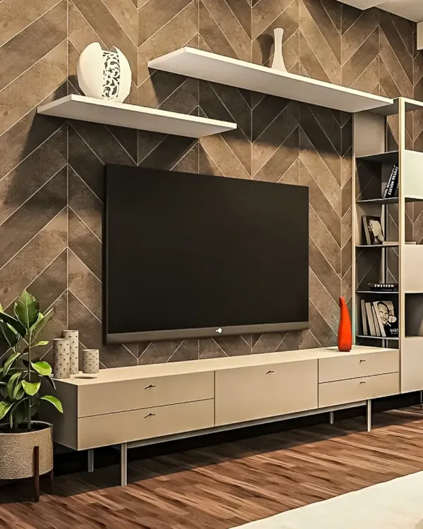 A modern TV unit with an asymmetrical design, featuring floating white shelves and a sleek console. The unit is set against a dark wood chevron-patterned wall for a dramatic effect.