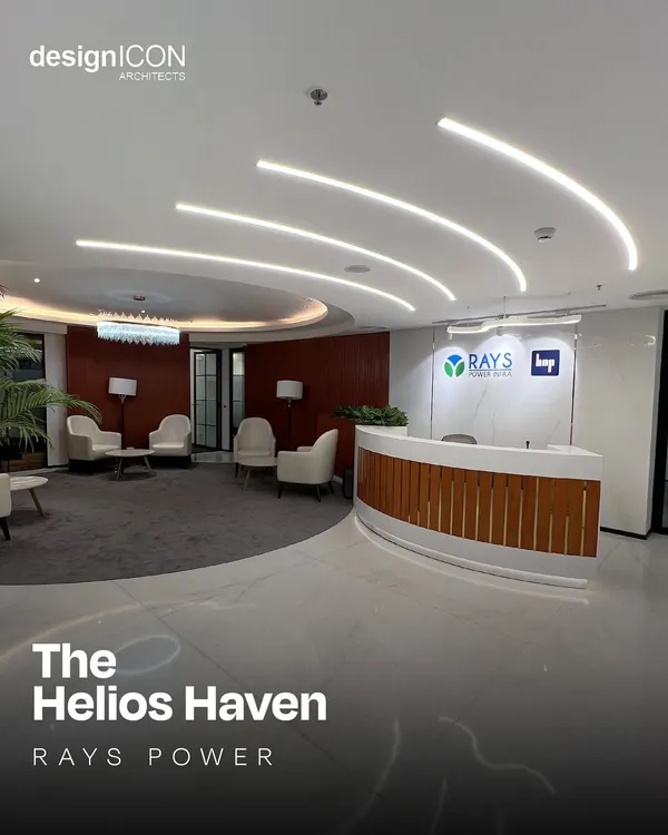 The reception area for Rays Power, where curved lighting and a streamlined desk create a welcoming and modern first impression. This space, called 'The Helios Haven', was designed to reflect the client's forward-thinking ethos through fluid lines and a clean, luminous aesthetic.