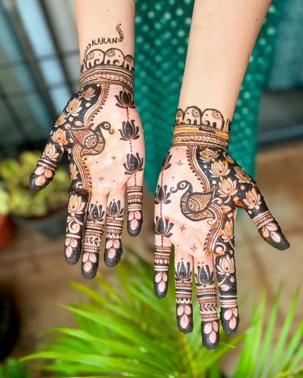 A classic design featuring peacocks and lotus flowers, which are symbols of beauty and purity in Indian culture. The wristband is adorned with a row of tiny elephants.