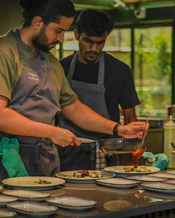 In the kitchen during a busy service. Concentration and teamwork are the keys to a successful private event.