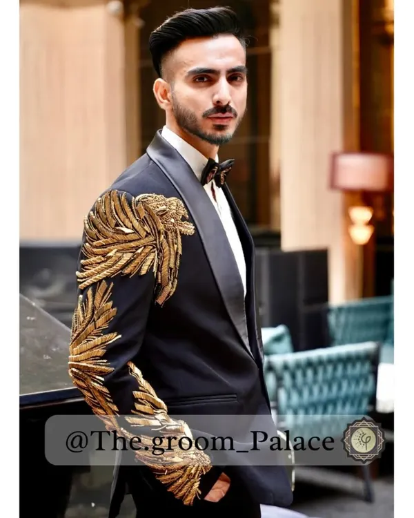 This is where modern style meets timeless craft. I designed this custom tuxedo with bold, hand-embroidered golden wings to create a look that's unforgettable. It's a perfect statement piece for a reception or cocktail event, made to fit you perfectly.