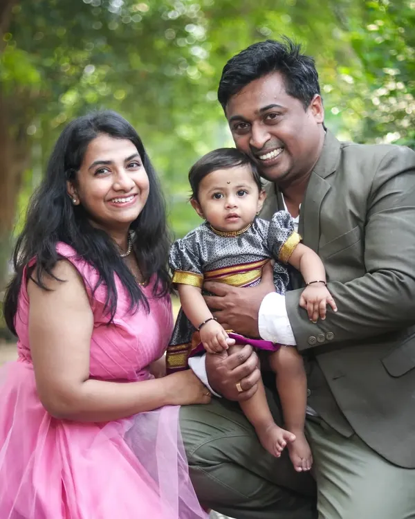 A classic family portrait taken in a lovely green park. My goal is to make everyone feel comfortable, resulting in natural smiles and a photo you'll cherish for years.