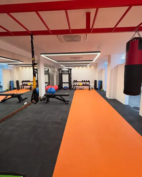 A view of our spacious and well-equipped Noida facility. The setup includes a running track, a punching bag, and various strength training tools to accommodate diverse rehabilitation needs.