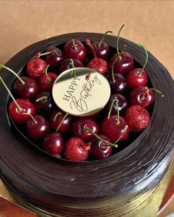 Introducing my season special: the Cherryoclate cake. It's Belgian chocolate paired with the freshest cherries from Himachal. Chocolate sponges are soaked in cherry juice, filled with compote and fresh cherries, and covered in ganache.