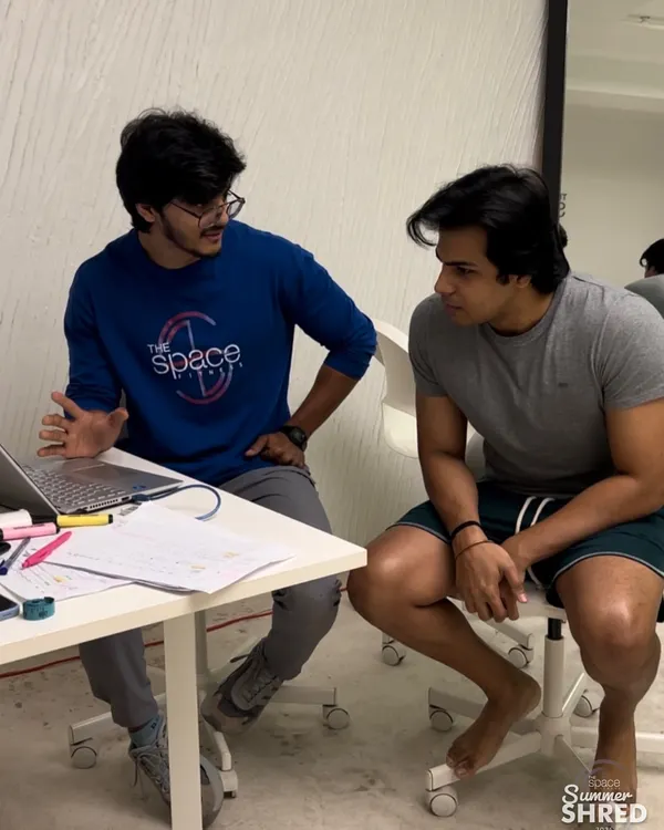 The process starts with a conversation. Here, I'm sitting down with a client during our Summer Shred program to go over his InBody results and fine-tune his plan. We believe in a data-driven, personalized approach.