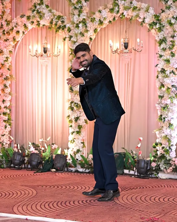 The groom striking a pose during his solo performance. I work with grooms to build their confidence and bring out their inner superstar on the dance floor.
