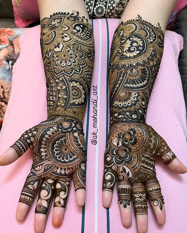 A complete bridal look with intricate patterns covering the full length of the arms. I've used a mix of bold floral work and delicate, detailed fillers to create a rich and luxurious design.