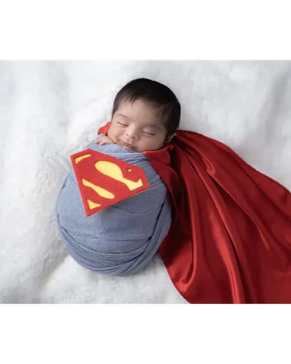 Your little one is already a superhero in your eyes, and we can create a fun photoshoot to match. This custom Superman theme shows how we can play with creative ideas to capture your baby's budding personality in a unique and memorable way.